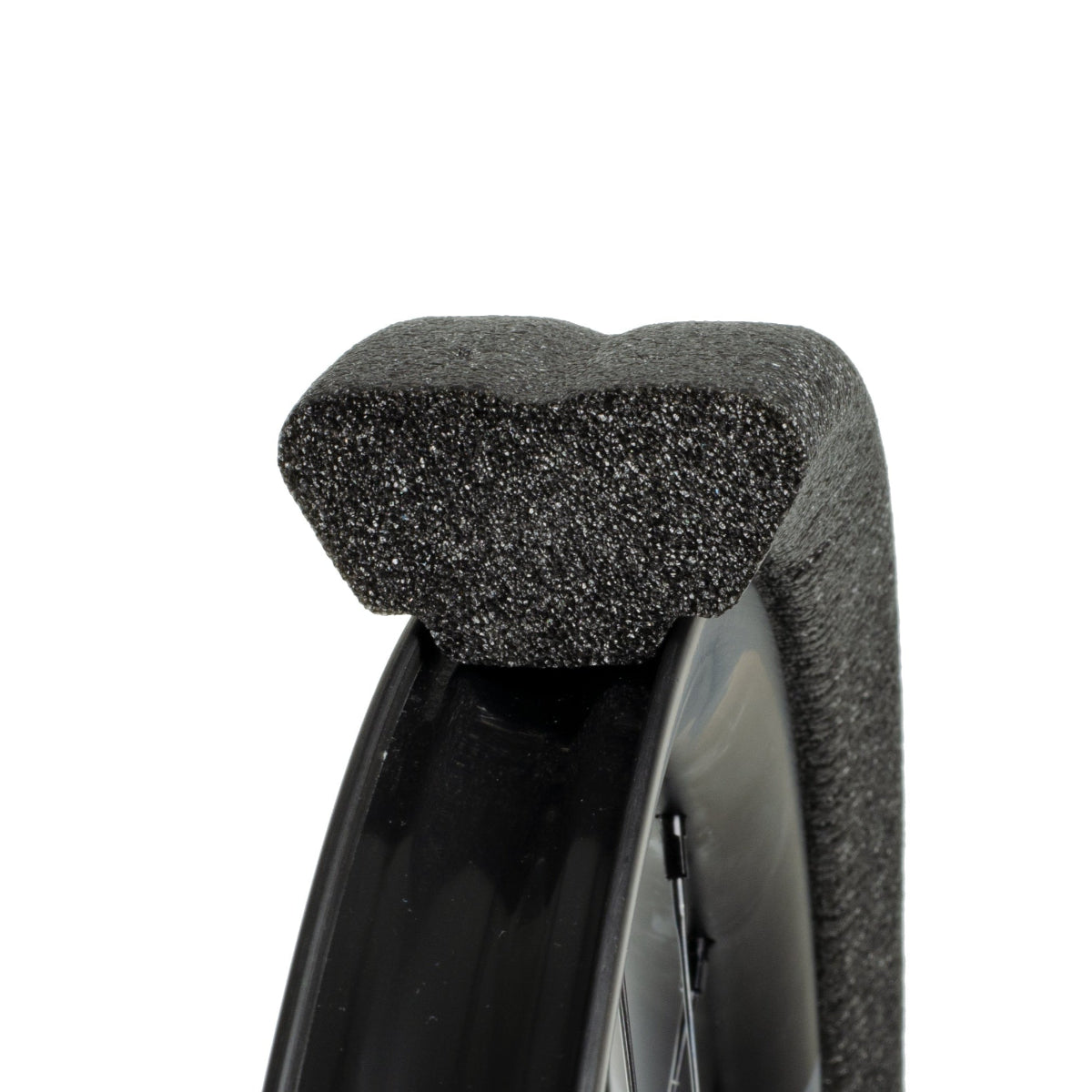 Closeup of Gnarly black tubeless tyre insert  seated on mtb rim white background