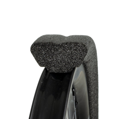 Closeup of Gnarly black tubeless tyre insert  seated on mtb rim white background