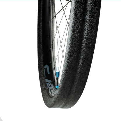 Black Gnarly tubeless tyre insert and high flow valve installed on rim