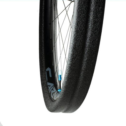 Black Gnarly tubeless tyre insert and high flow valve installed on rim