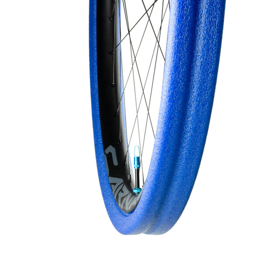 Blue Gnarly tubeless tyre insert and high flow valve installed on rim