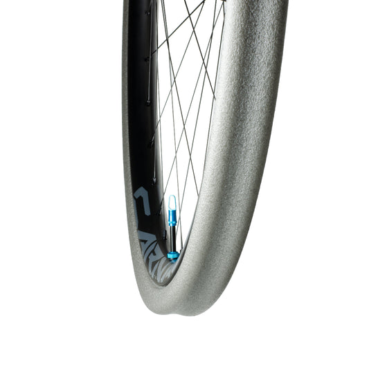 Grey Gnarly tubeless tyre insert and high flow valve installed on rim