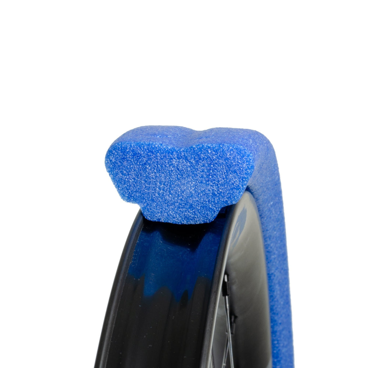 Closeup of Gnarly blue tubeless tyre insert  seated on mtb rim white background
